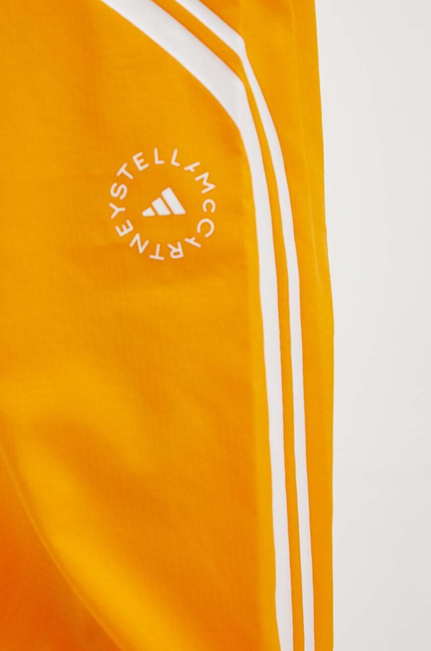 adidas by Stella McCartney Tréninkové kalhoty TruePace oranžová barva s potiskem - Pepit.cz