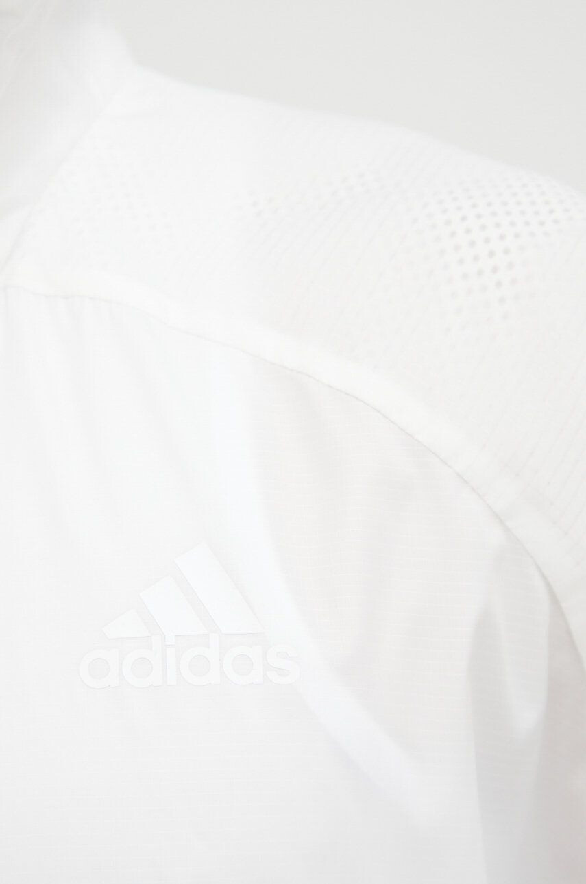 adidas Performance Větrovka Traveer bílá barva přechodná oversize - Pepit.cz