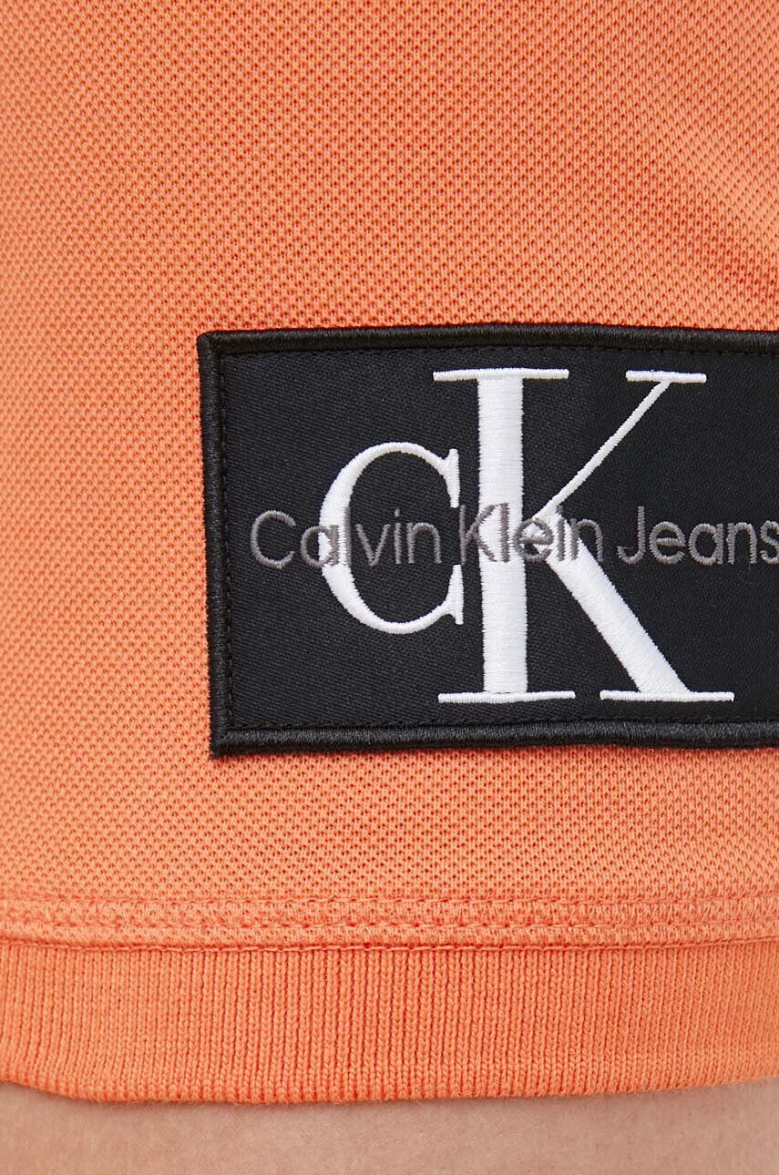 Calvin Klein Jeans Bavlněné polo tričko oranžová barva - Pepit.cz