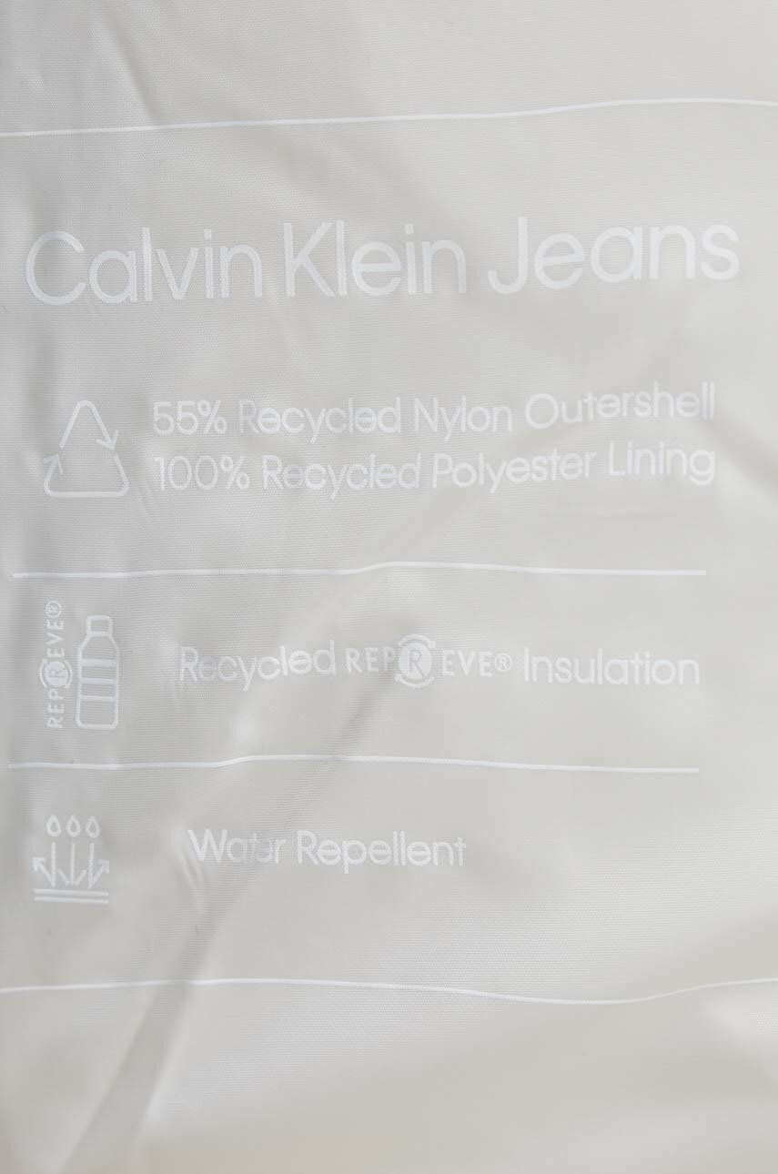 Calvin Klein Jeans Bunda dámská béžová barva zimní - Pepit.cz