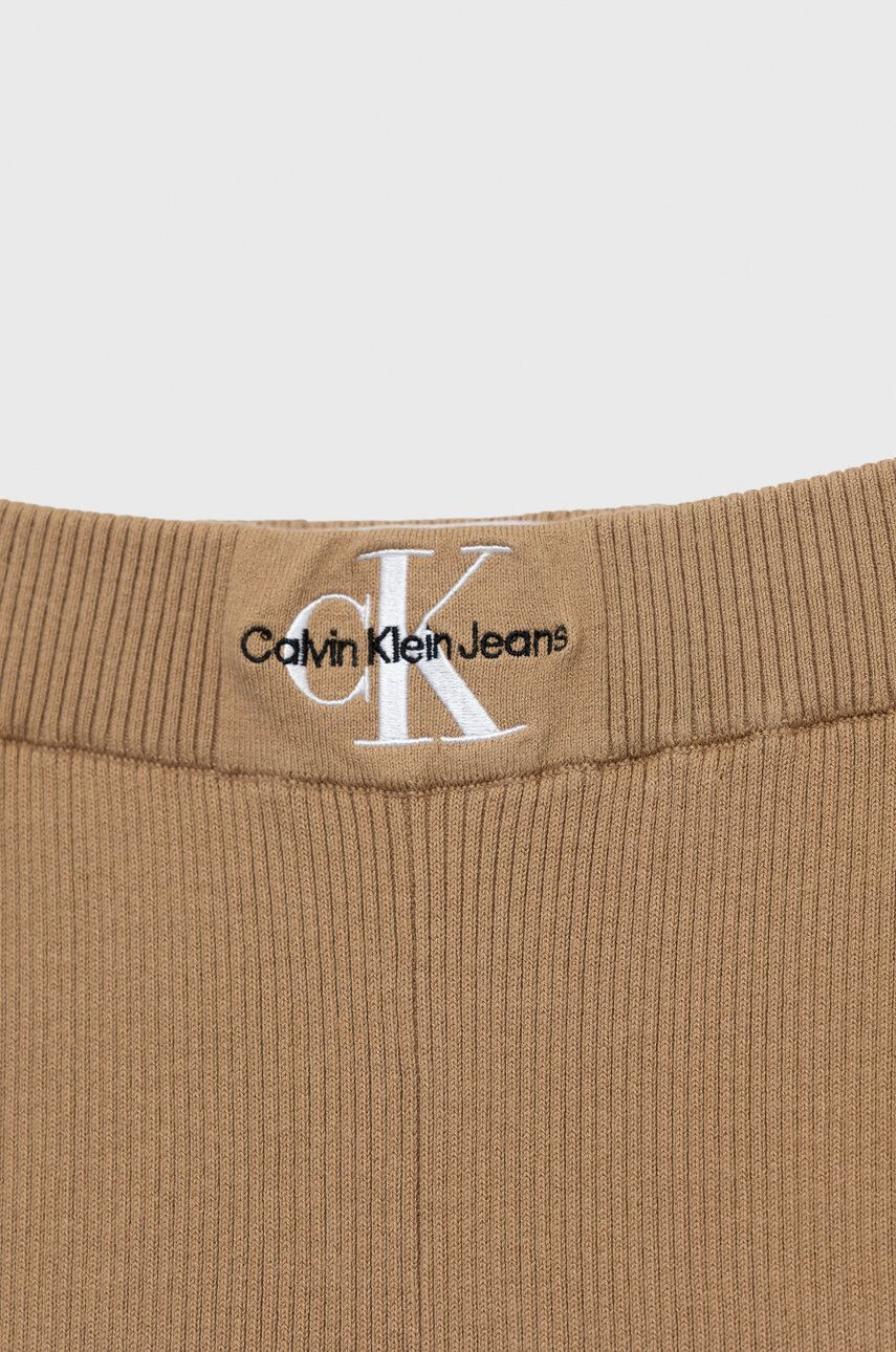 Calvin Klein Jeans Dětské kalhoty béžová barva hladké - Pepit.cz