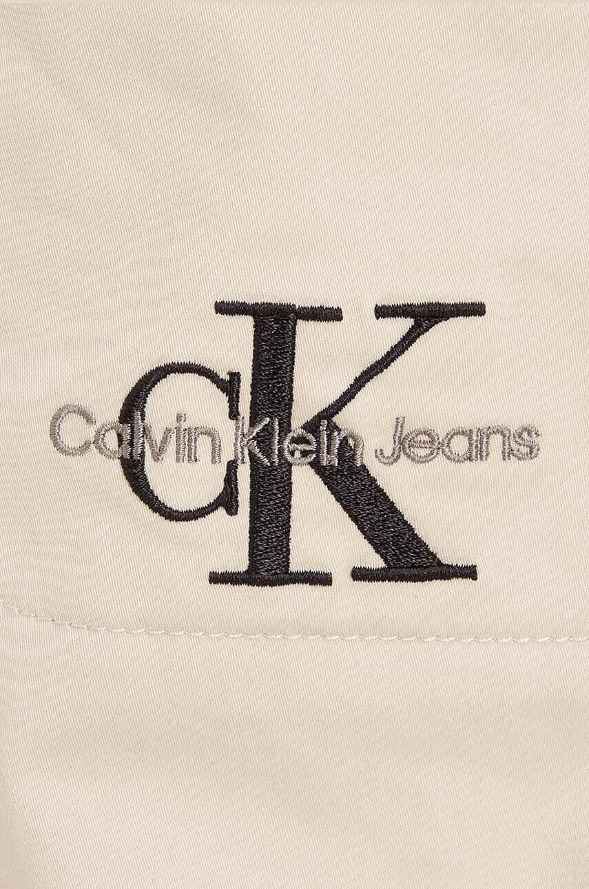 Calvin Klein Jeans Dětské kalhoty béžová barva hladké - Pepit.cz