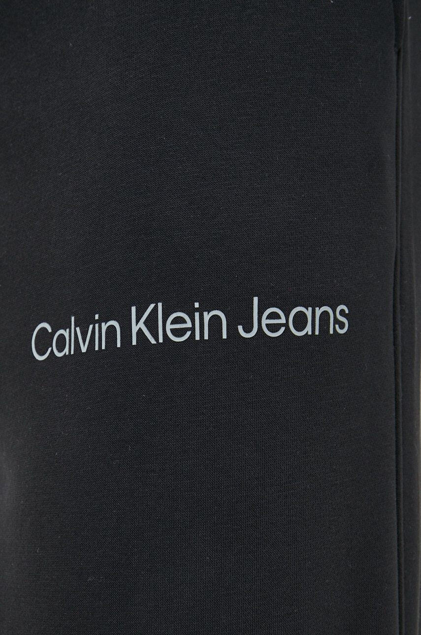 Calvin Klein Jeans Tepláky pánské černá barva s potiskem - Pepit.cz