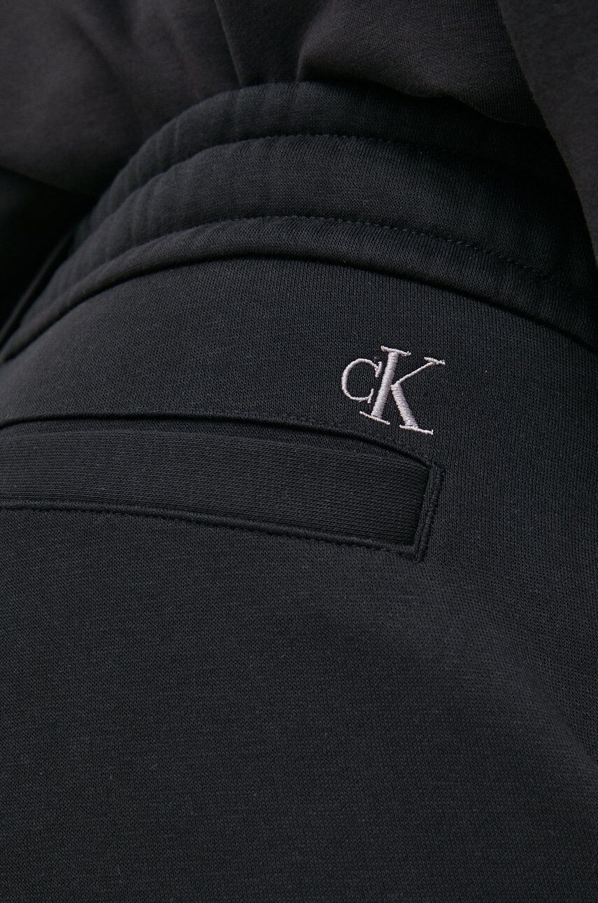 Calvin Klein Jeans Tepláky pánské černá barva s potiskem - Pepit.cz