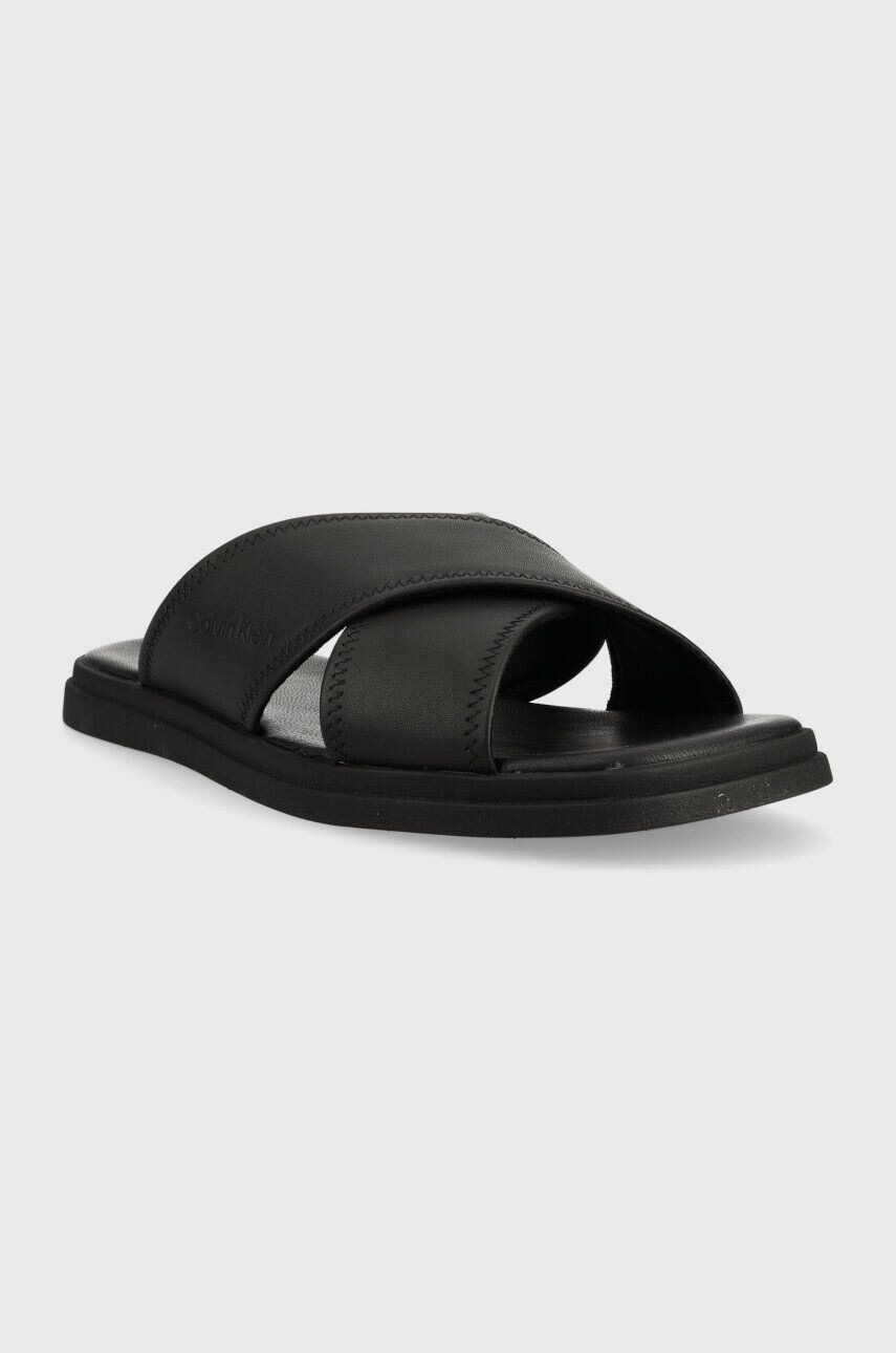 Calvin Klein Kožené pantofle CRISS CROSS SANDAL LTH pánské černá barva HM0HM00950 - Pepit.cz