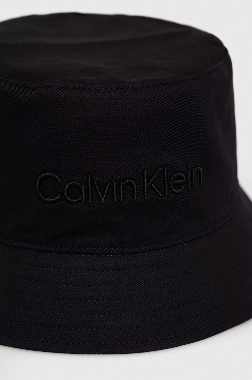 Calvin Klein Oboustranný bavlněný klobouk černá barva bavlněný - Pepit.cz