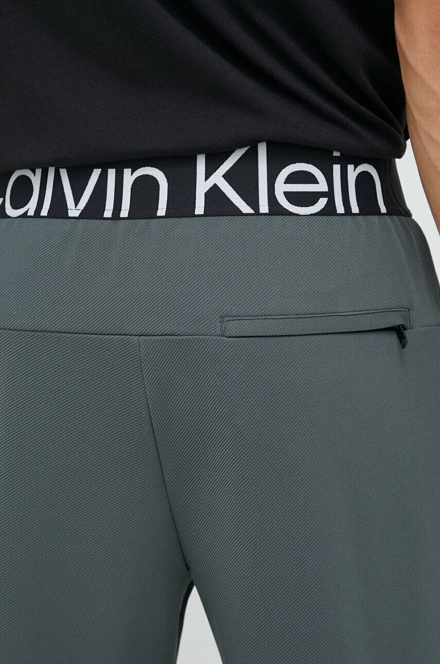 Calvin Klein Performance Tréninkové kalhoty Effect zelená barva hladké - Pepit.cz