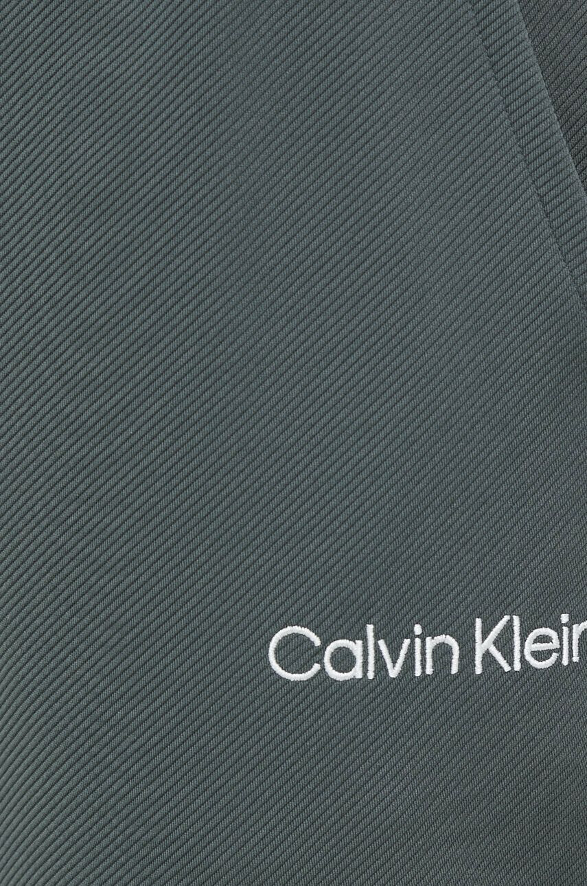 Calvin Klein Performance Tréninkové kalhoty Effect zelená barva hladké - Pepit.cz