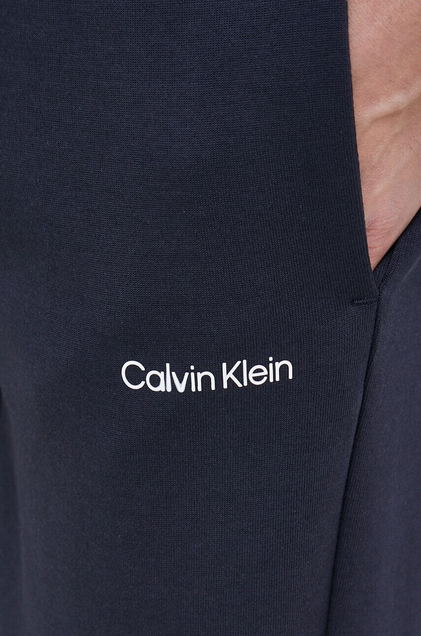 Calvin Klein Tepláky pánské tmavomodrá barva hladké - Pepit.cz