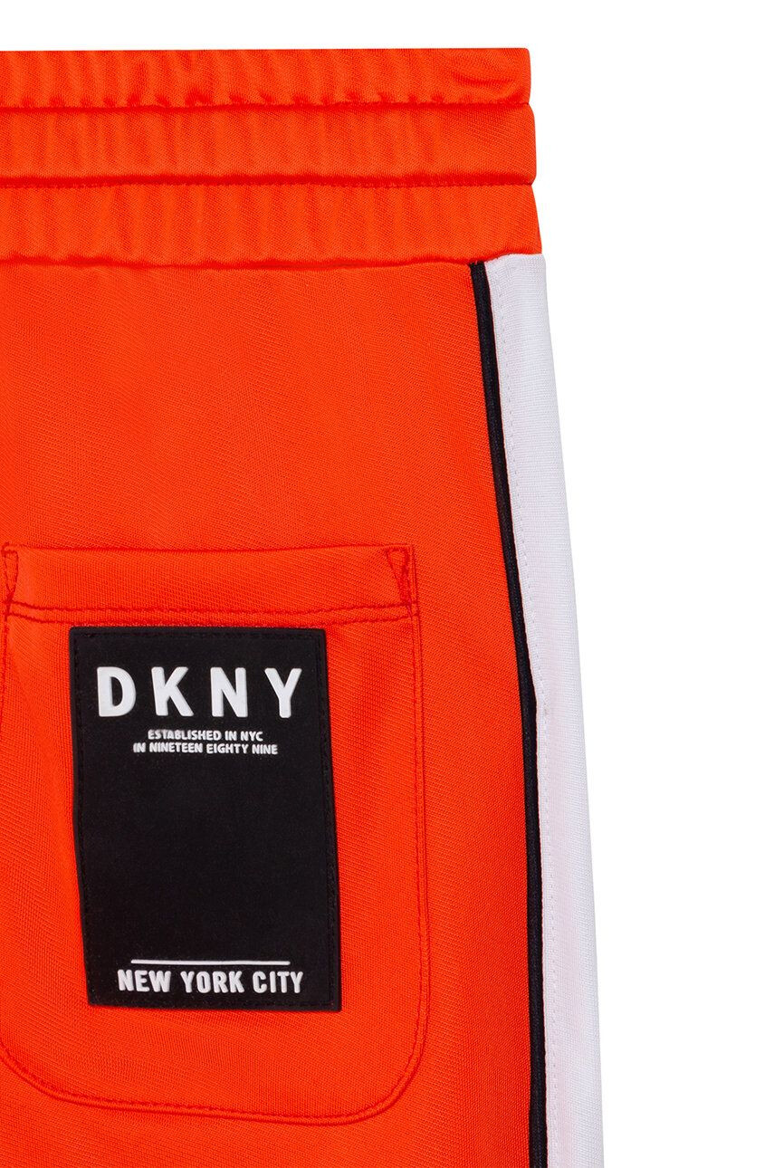 DKNY Dětské kalhoty oranžová barva vzorované - Pepit.cz