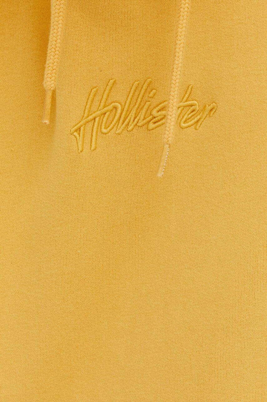 Hollister Co. Mikina pánská žlutá barva s kapucí s aplikací - Pepit.cz