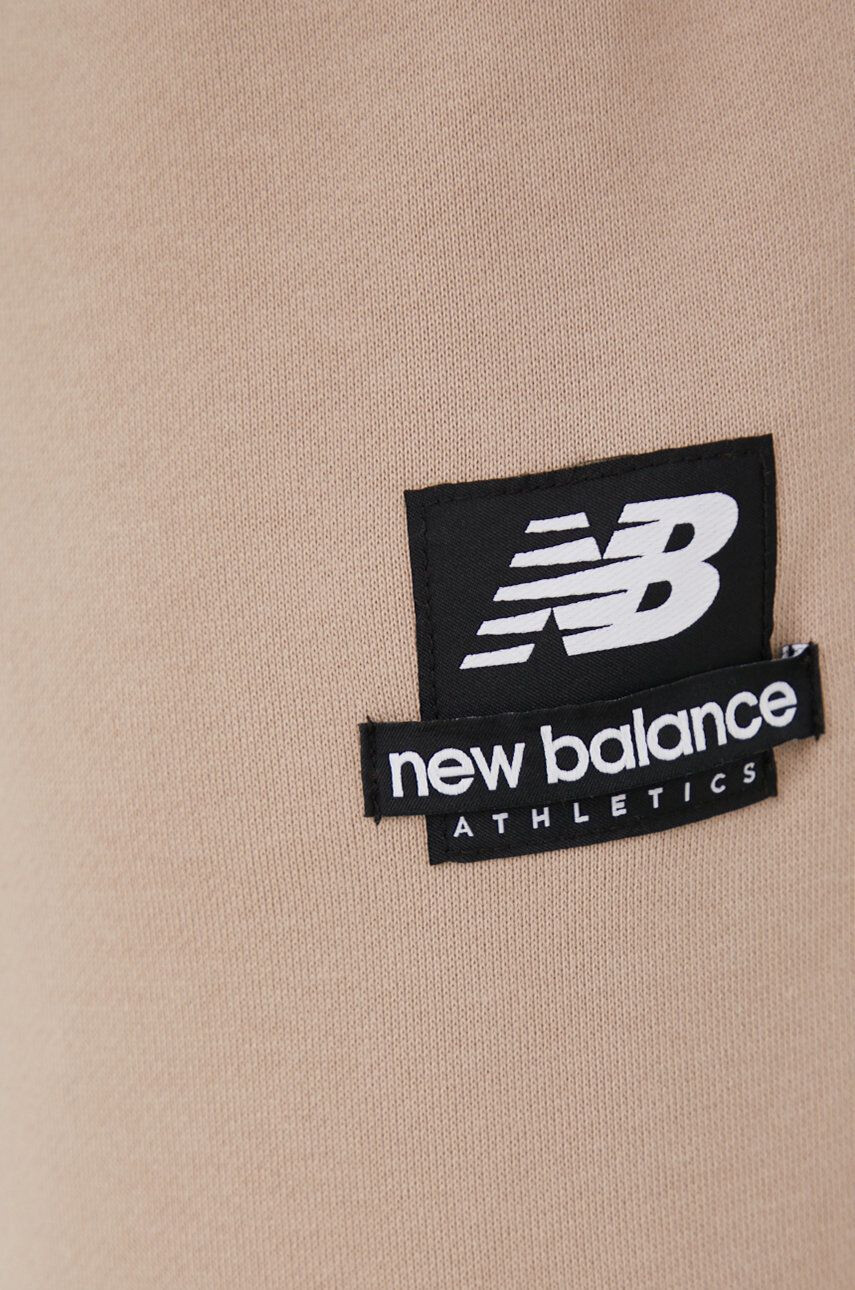 New Balance Bavlněné tepláky MP21550MDY pánské béžová barva s potiskem MP21550MDY-MDY - Pepit.cz