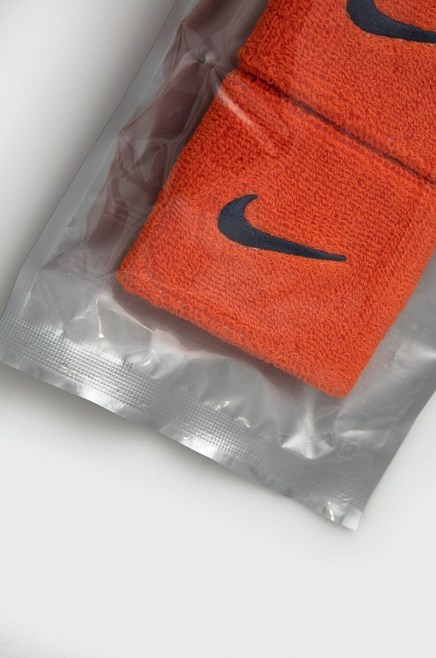 Nike Pásek na zápěstí oranžová barva - Pepit.cz