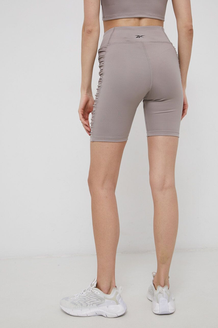 Reebok Tréninkové šortky H56373 dámské žlutá barva hladké high waist - Pepit.cz