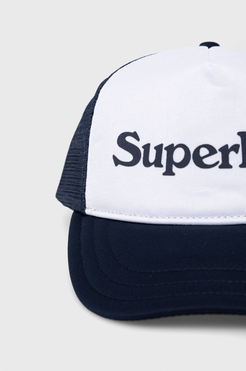 Superdry Čepice tmavomodrá barva s potiskem - Pepit.cz