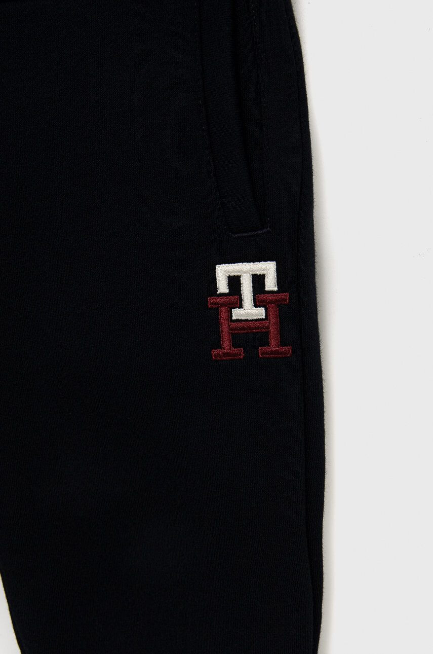 Tommy Hilfiger Dětské tepláky tmavomodrá barva hladké - Pepit.cz