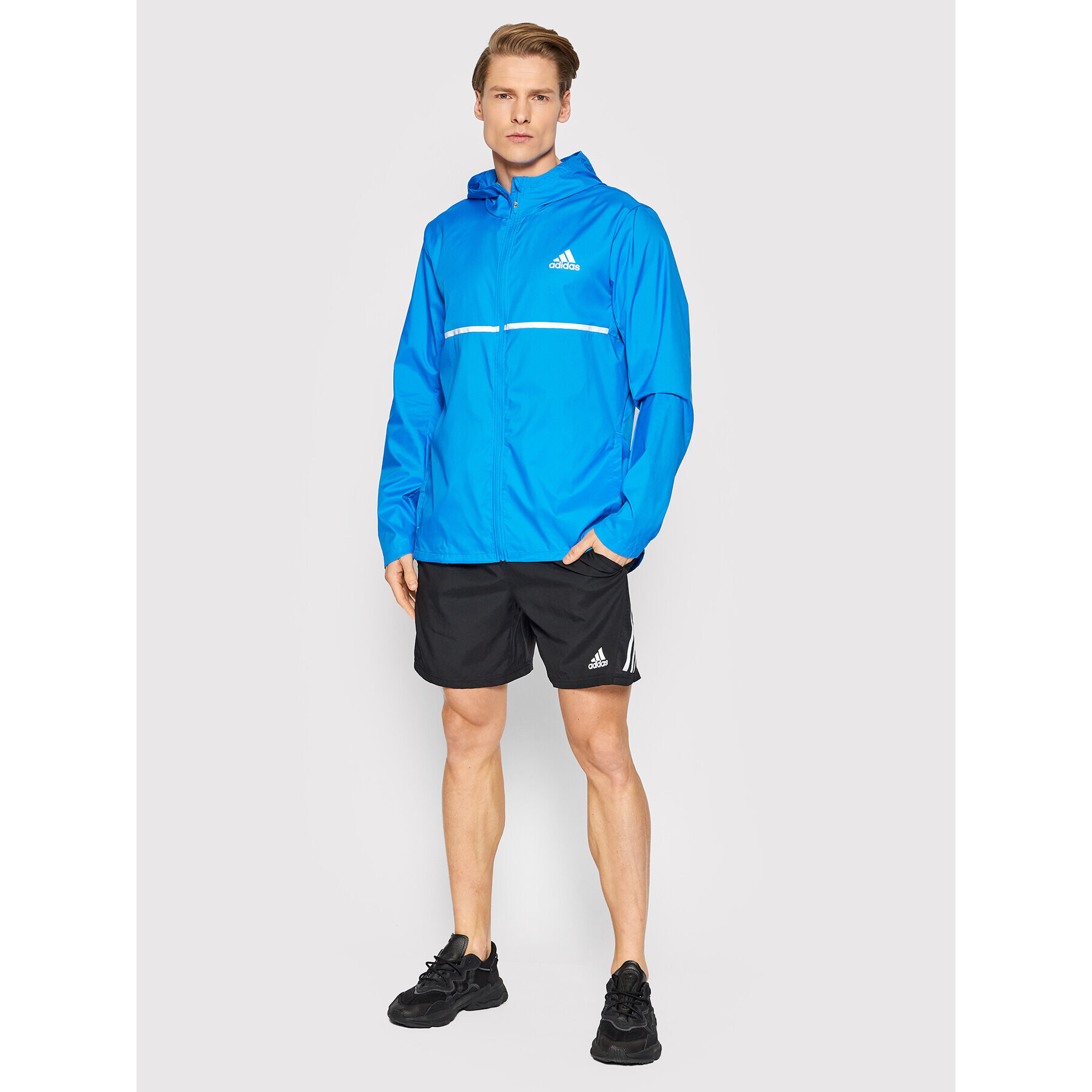 adidas Běžecká bunda Own the Run HB7426 Modrá Regular Fit - Pepit.cz