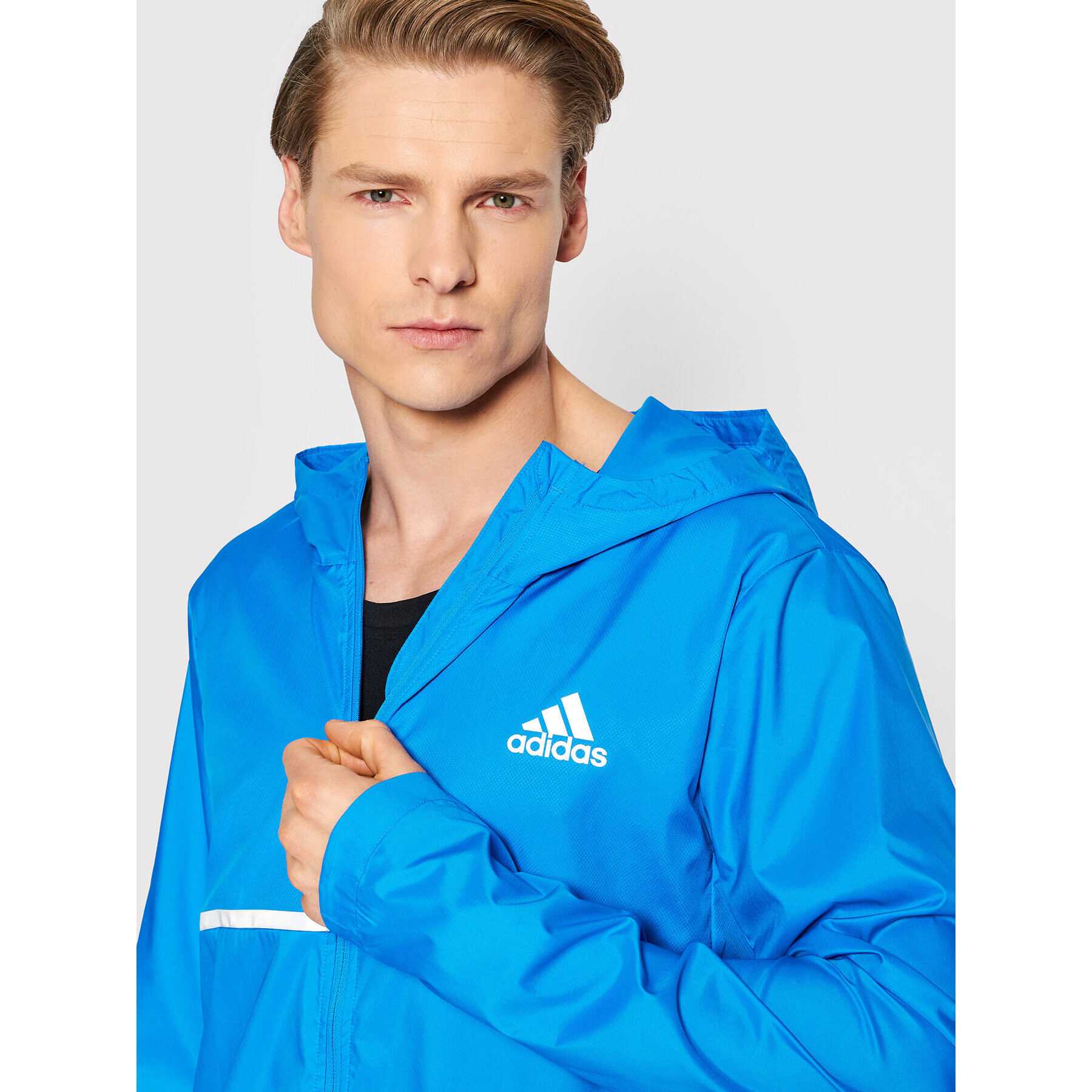 adidas Běžecká bunda Own the Run HB7426 Modrá Regular Fit - Pepit.cz