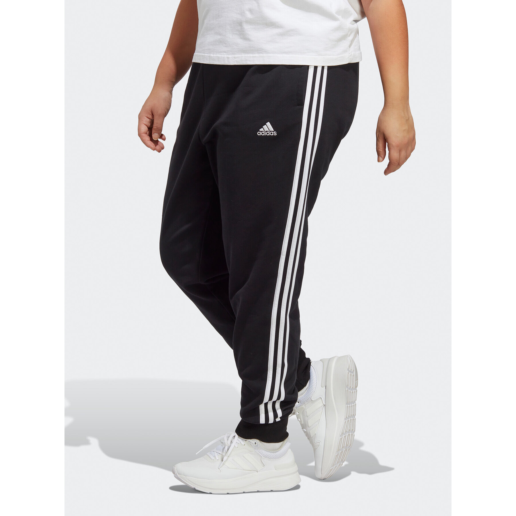 adidas Teplákové kalhoty Essentials 3-Stripes French Terry Cuffed Joggers (Plus Size) IB8745 Černá Slim Fit - Pepit.cz