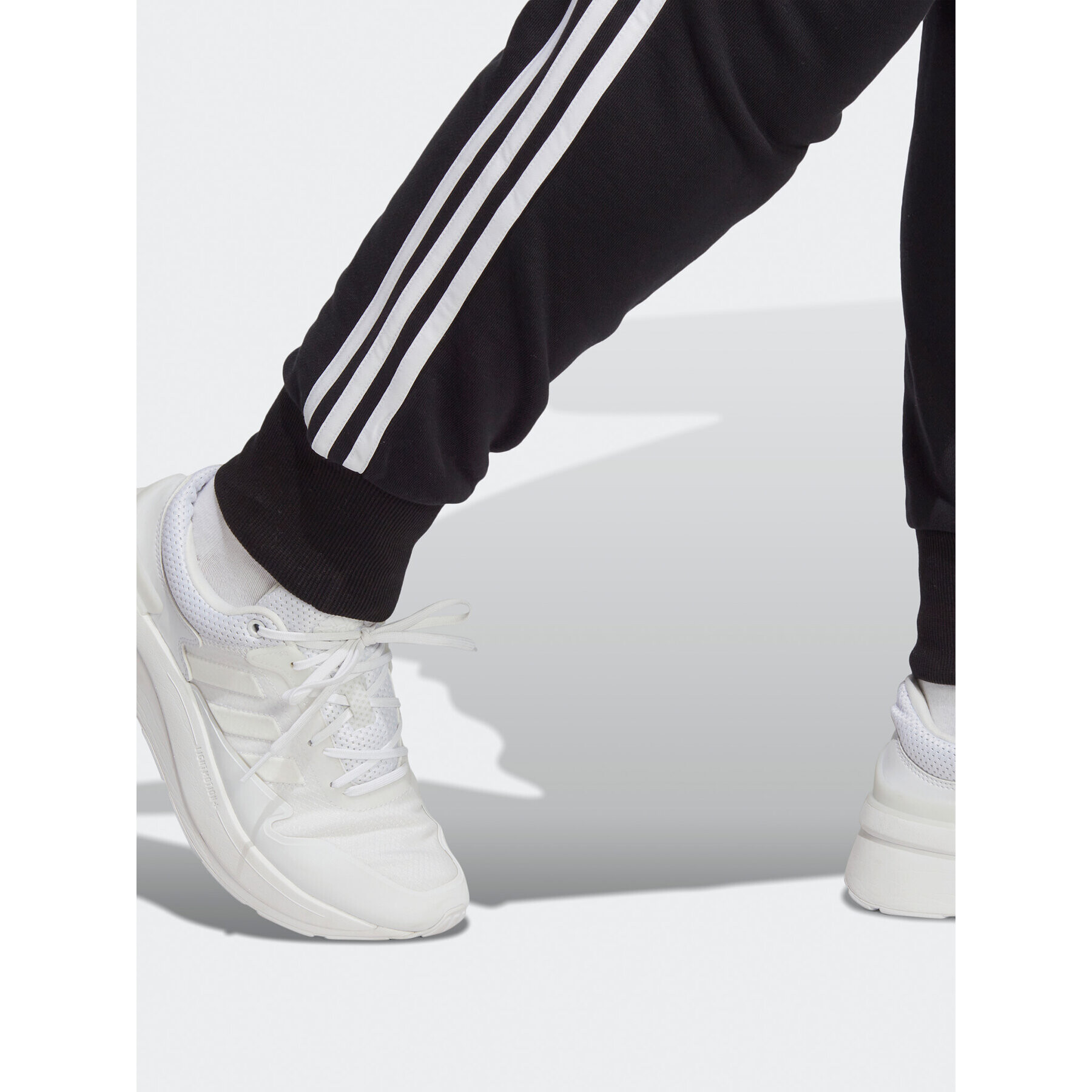 adidas Teplákové kalhoty Essentials 3-Stripes French Terry Cuffed Joggers (Plus Size) IB8745 Černá Slim Fit - Pepit.cz