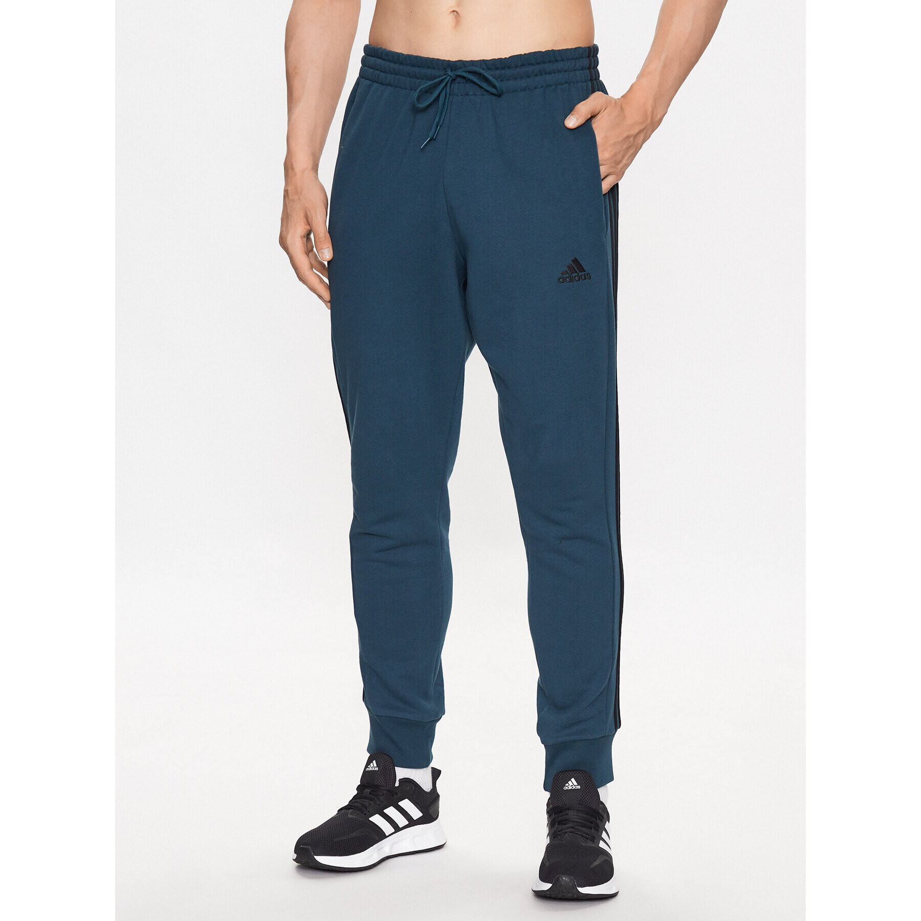 adidas Teplákové kalhoty Essentials French Terry Tapered Cuff 3-Stripes Joggers IJ8698 Tyrkysová Regular Fit - Pepit.cz