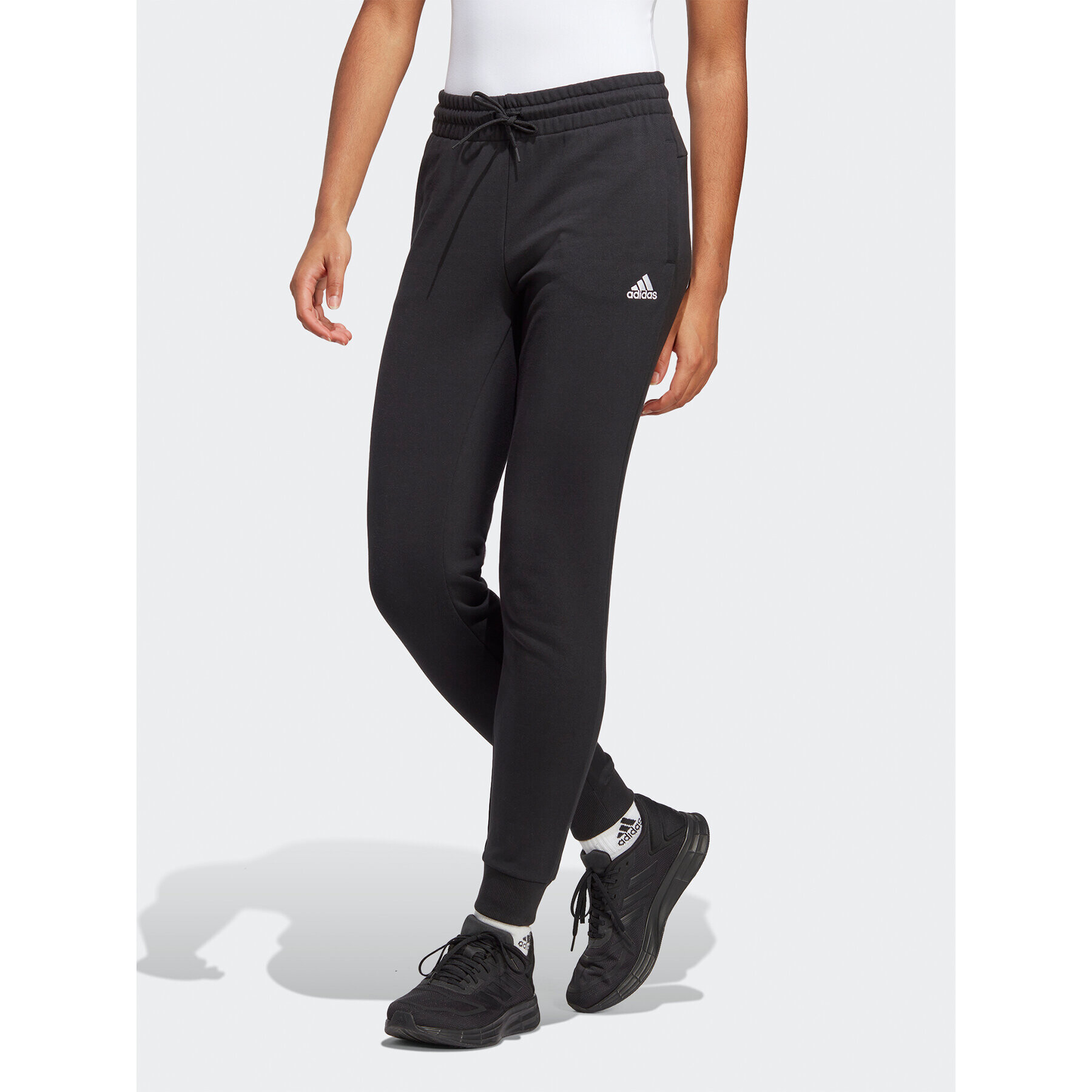 adidas Teplákové kalhoty Essentials Linear French Terry Cuffed Joggers IC6868 Černá Slim Fit - Pepit.cz