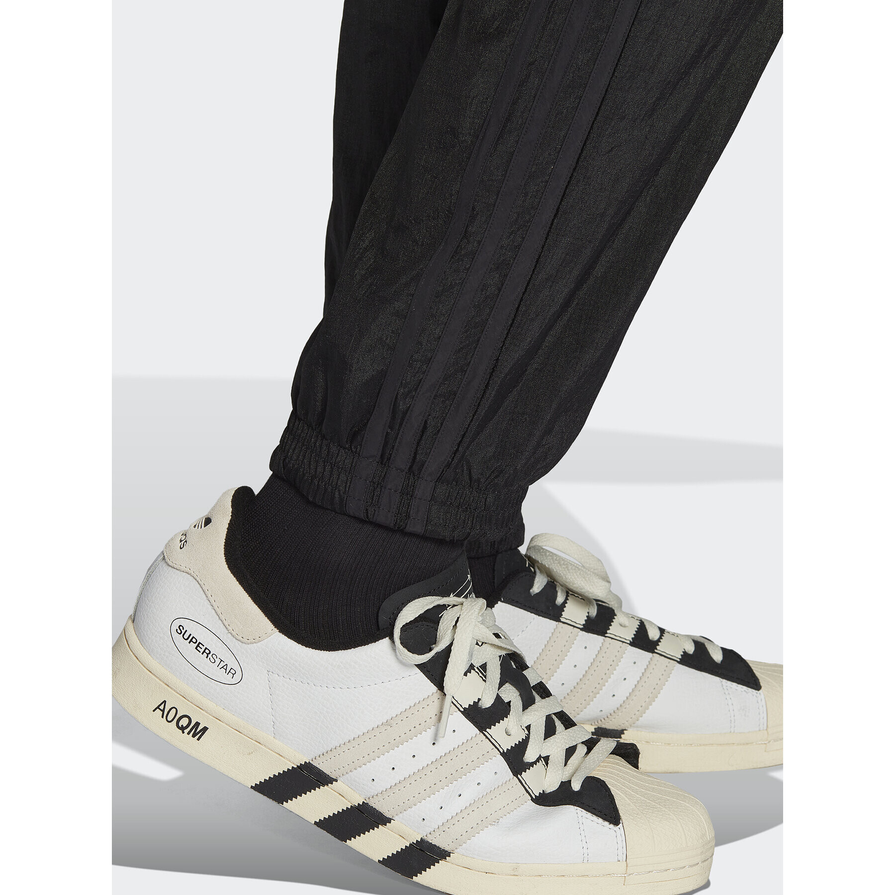 adidas Teplákové kalhoty Reveal Material Mix HK2732 Černá Regular Fit - Pepit.cz