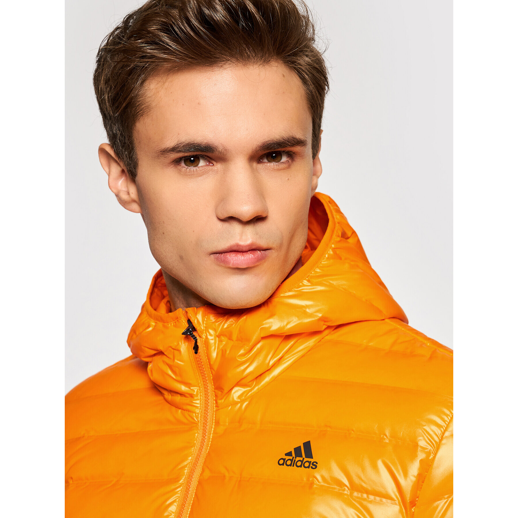 adidas Vatovaná bunda Varilite Hooded GT9215 Oranžová Slim Fit - Pepit.cz