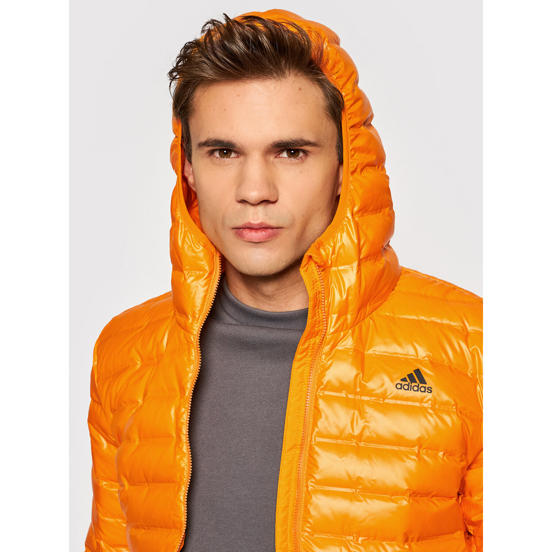 adidas Vatovaná bunda Varilite Hooded GT9215 Oranžová Slim Fit - Pepit.cz