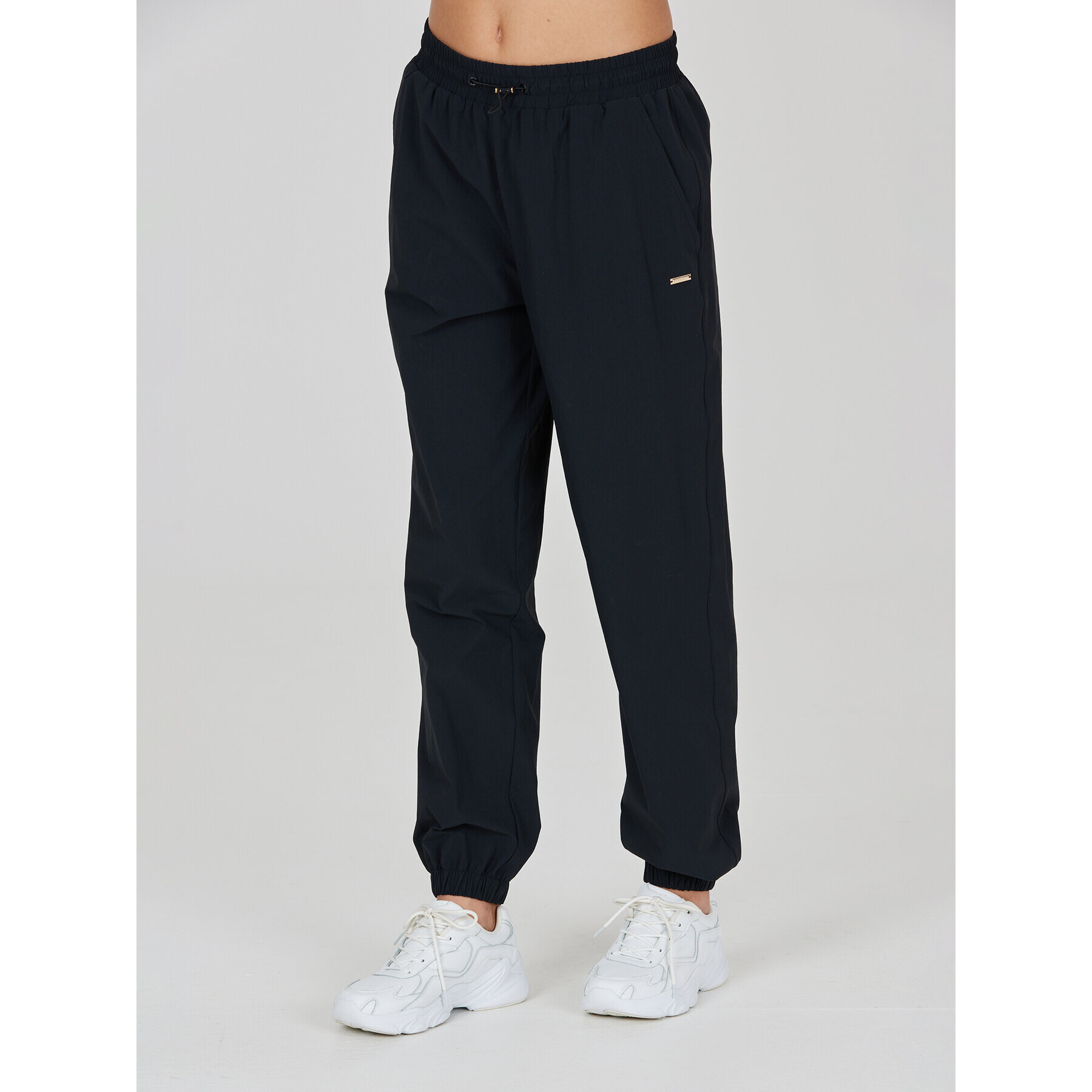 Athlecia Teplákové kalhoty Hero W Track Pants EA233336 Černá Regular Fit - Pepit.cz