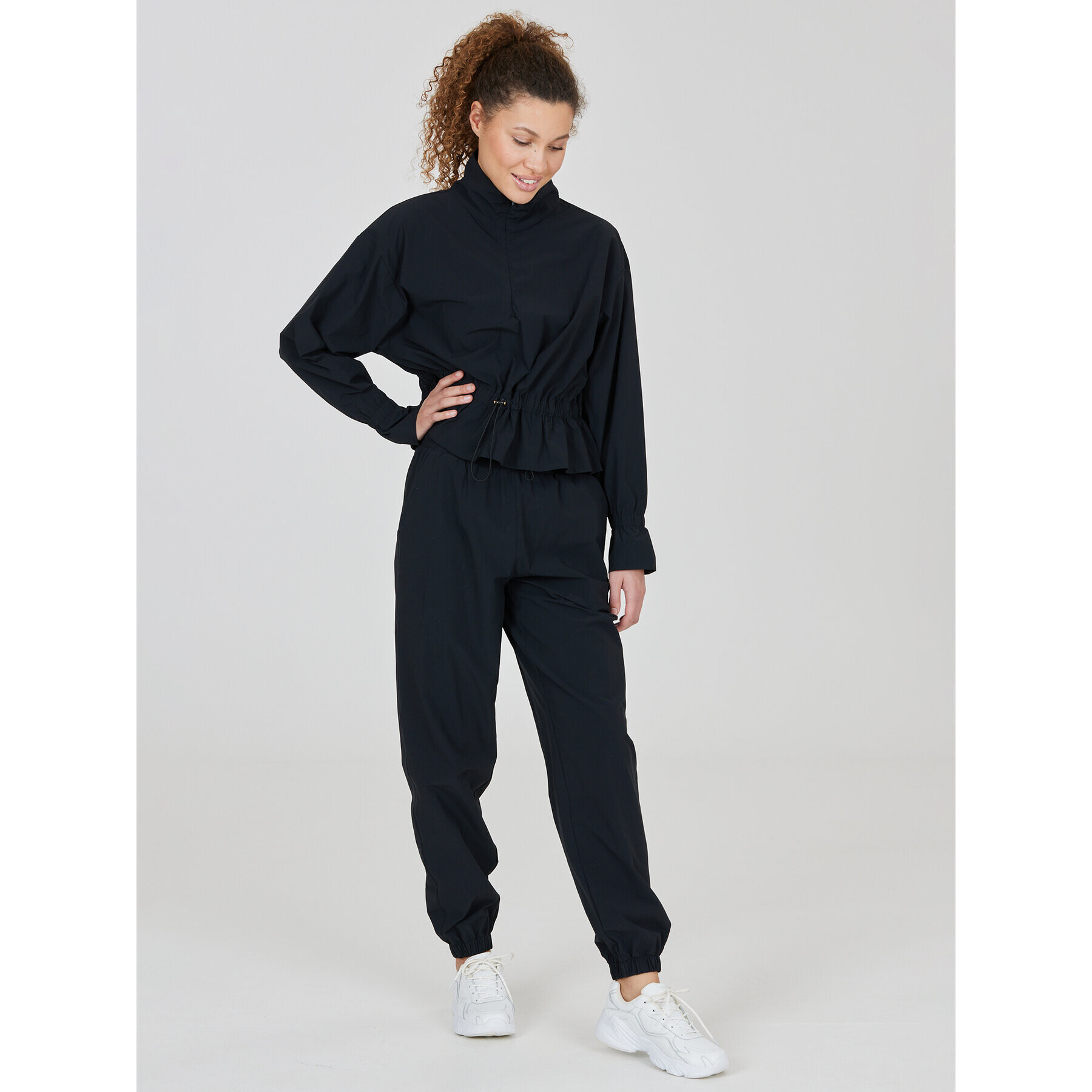 Athlecia Teplákové kalhoty Hero W Track Pants EA233336 Černá Regular Fit - Pepit.cz