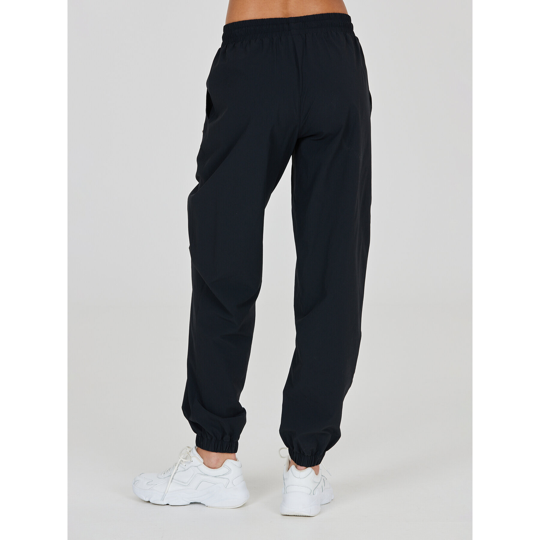 Athlecia Teplákové kalhoty Hero W Track Pants EA233336 Černá Regular Fit - Pepit.cz