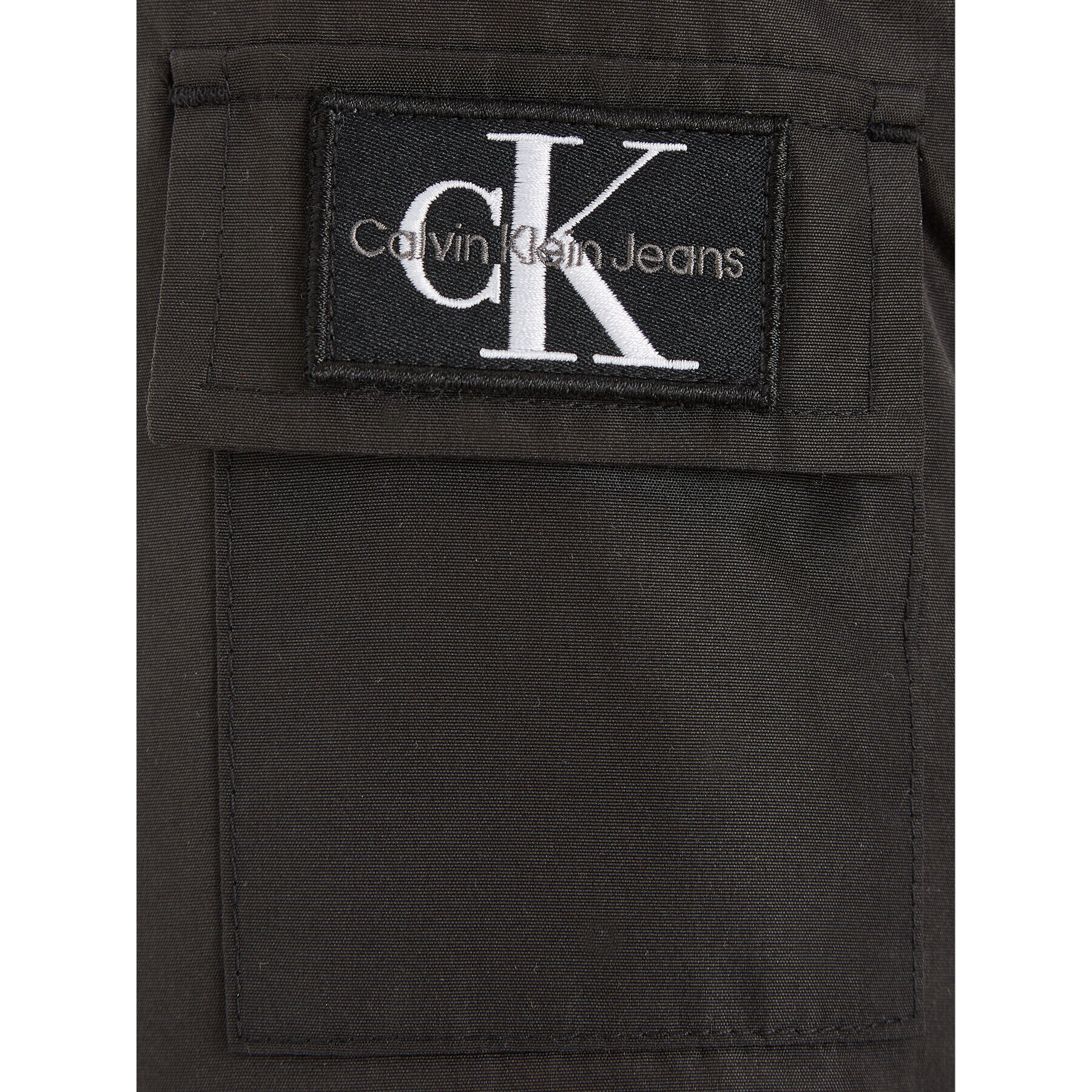 Calvin Klein Jeans Bunda pro přechodné období Back To Skool IB0IB01274 Černá Regular Fit - Pepit.cz