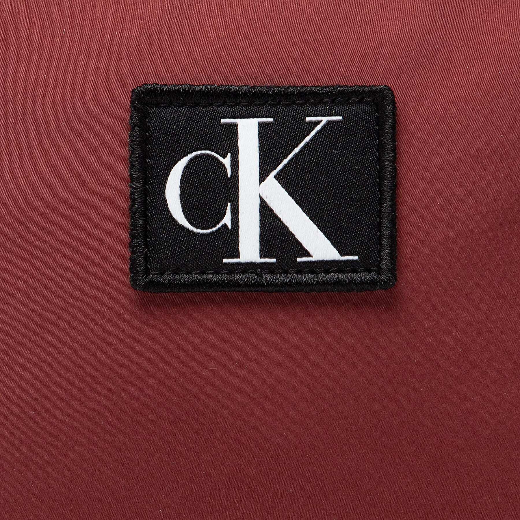 Calvin Klein Jeans Kabelka City Nylon Camera Bag20 K60K609797 Bordó - Pepit.cz