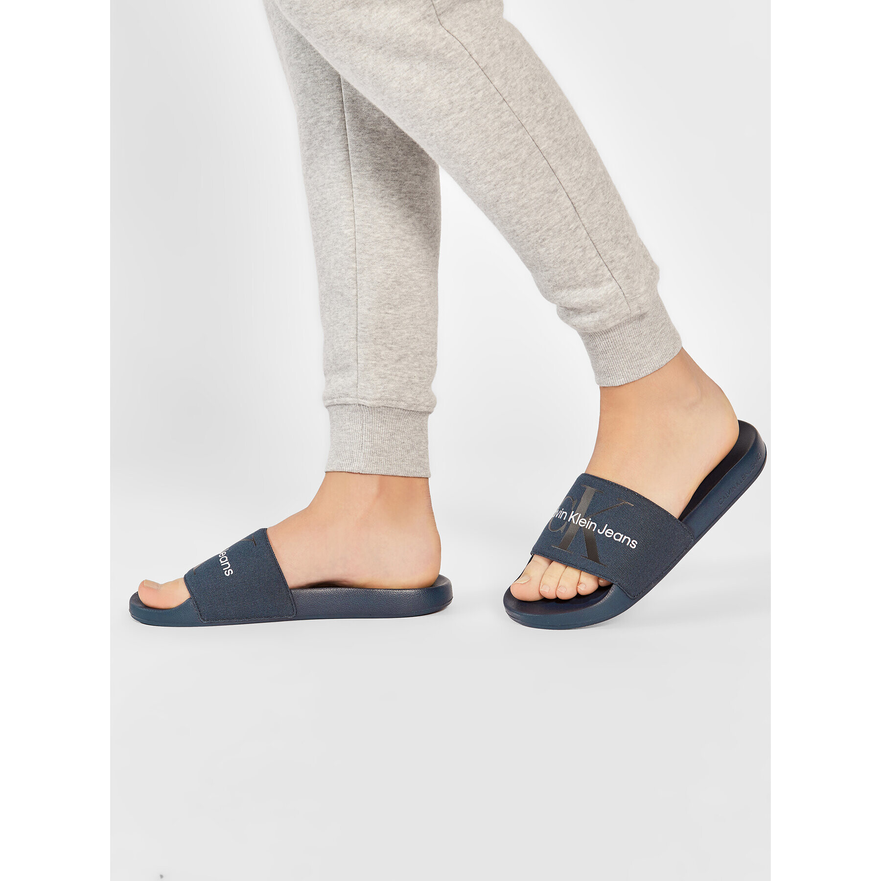 Calvin Klein Jeans Nazouváky SLide Monogram Co YM0YM00061 Tmavomodrá - Pepit.cz