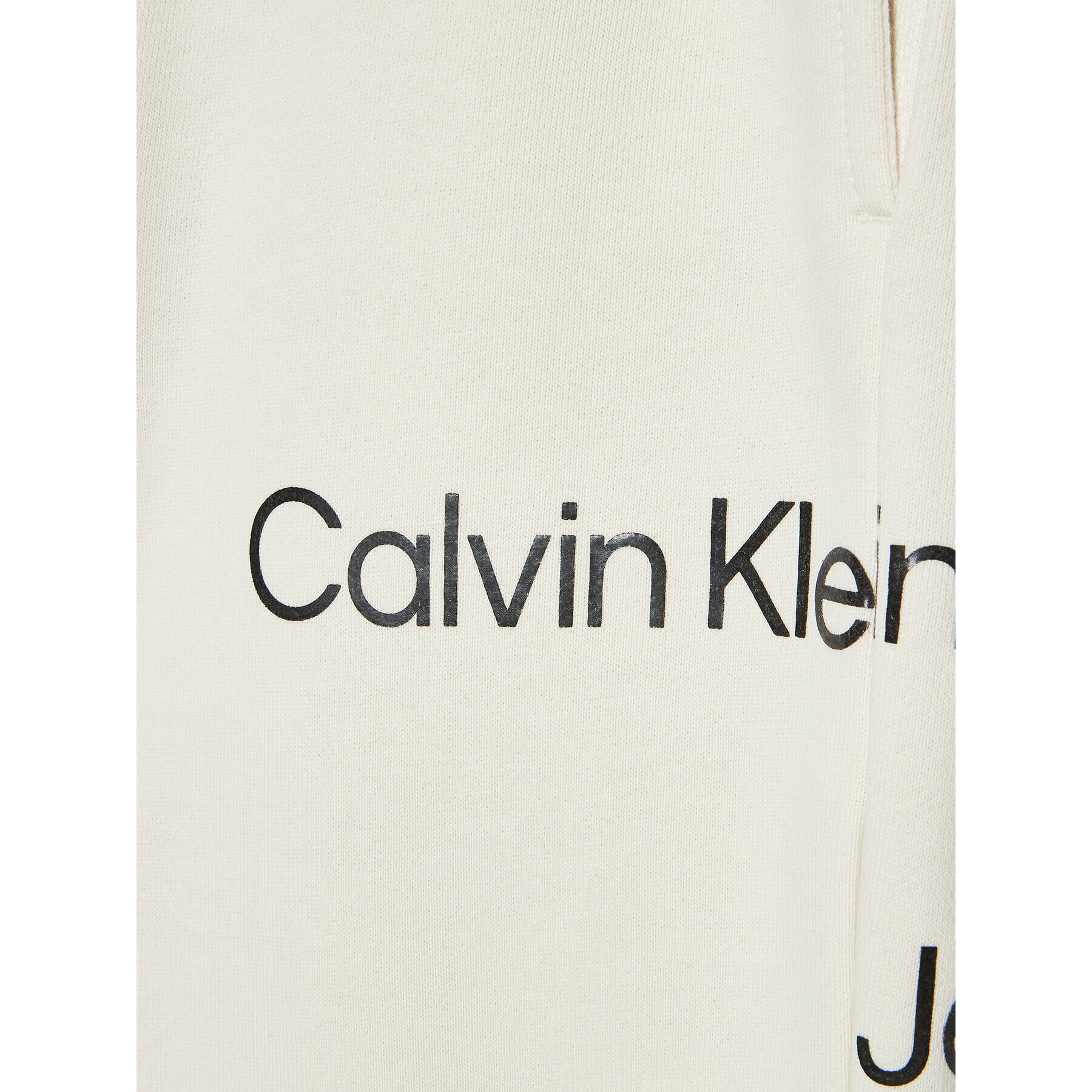 Calvin Klein Jeans Teplákové kalhoty Disrupted Inst. Logo IU0IU00323 Béžová Regular Fit - Pepit.cz