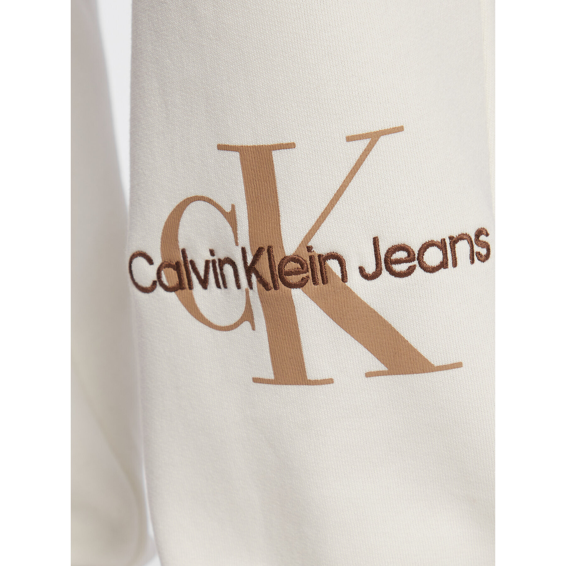 Calvin Klein Jeans Teplákové kalhoty J20J220265 Écru Relaxed Fit - Pepit.cz