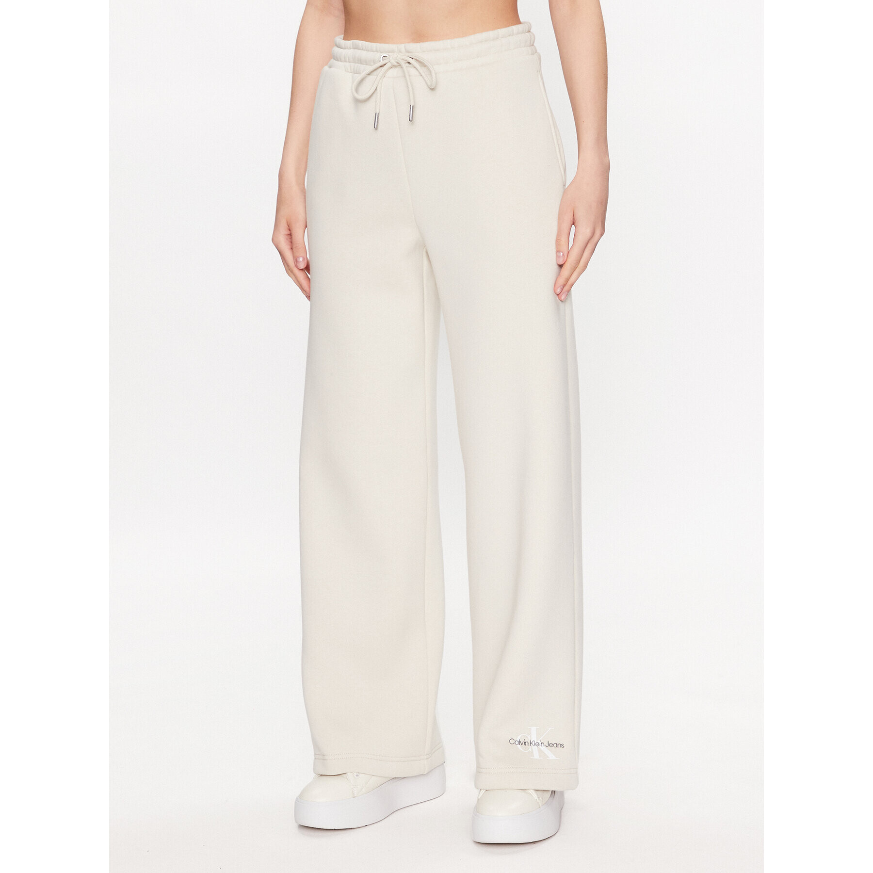 Calvin Klein Jeans Teplákové kalhoty J20J221296 Écru Relaxed Fit - Pepit.cz