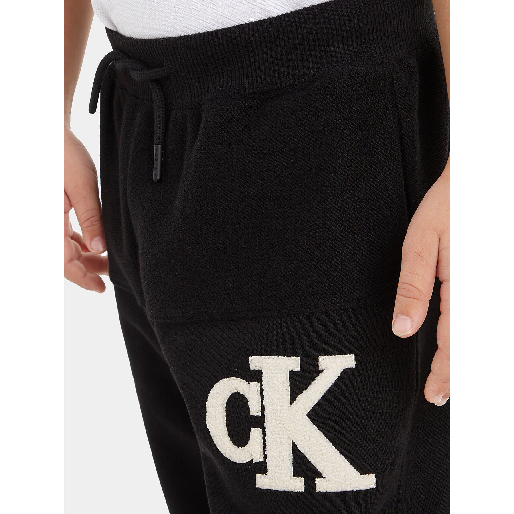 Calvin Klein Jeans Teplákové kalhoty Towelling Logopack IB0IB01677 Černá Regular Fit - Pepit.cz