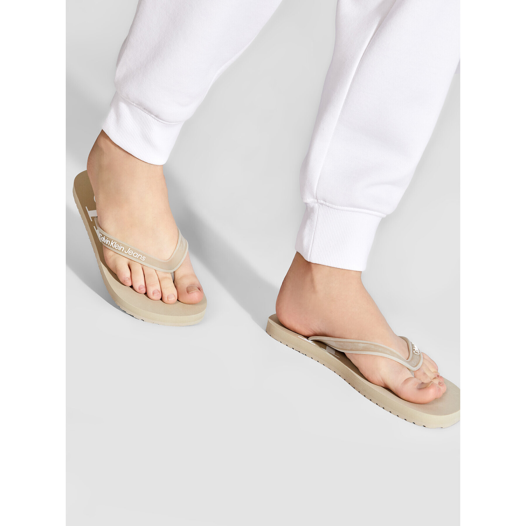 Calvin Klein Jeans Žabky Beach Sandal Monogram Tpu YM0YM00055 Béžová - Pepit.cz