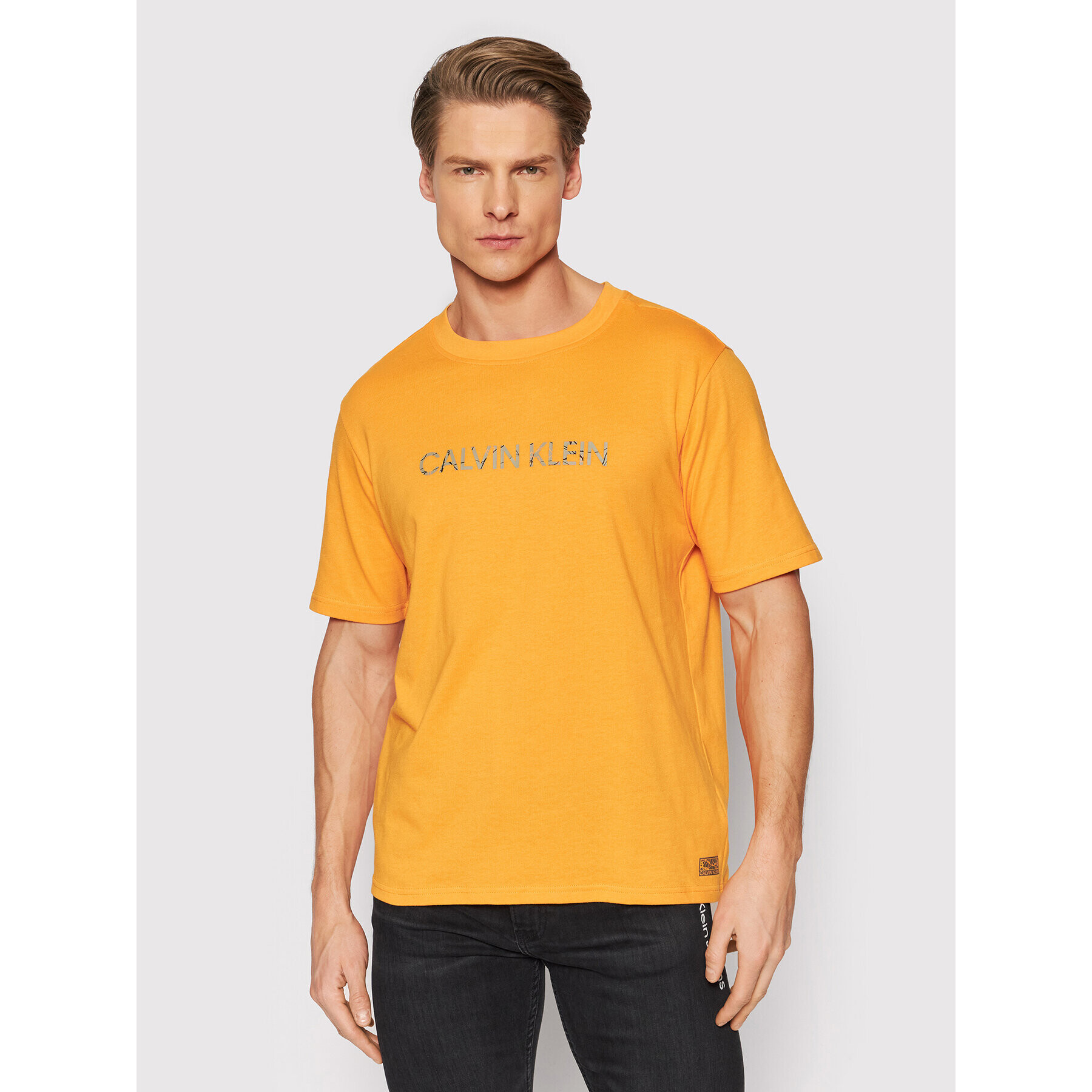 Calvin Klein Performance T-Shirt 00GMH1K104 Oranžová Regular Fit - Pepit.cz