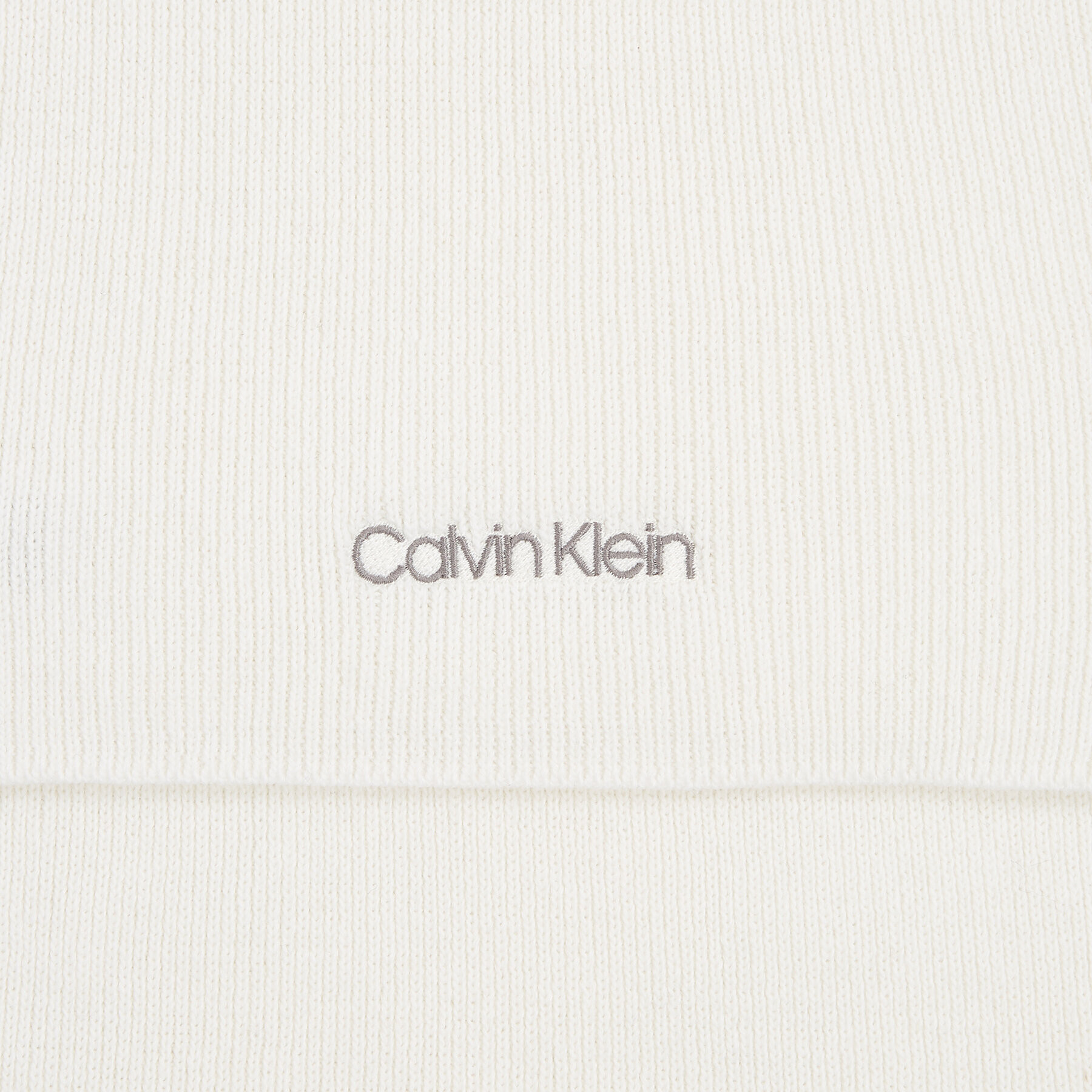 Calvin Klein Šál Essential Knit Scarf 30X180 K60K608485 Écru - Pepit.cz