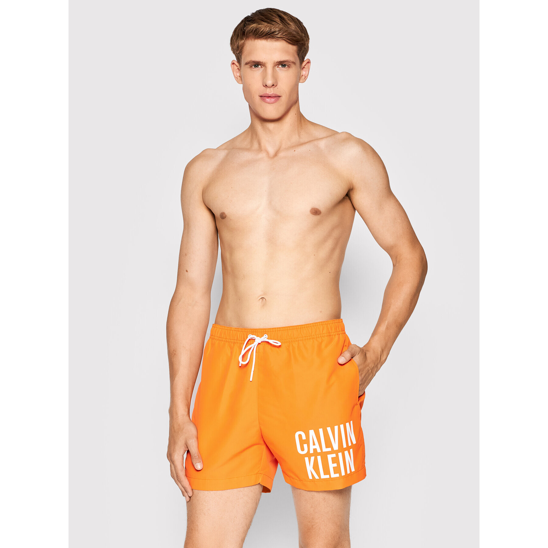 Calvin Klein Swimwear Plavecké šortky Intense Power KM0KM00701 Oranžová Regular Fit - Pepit.cz