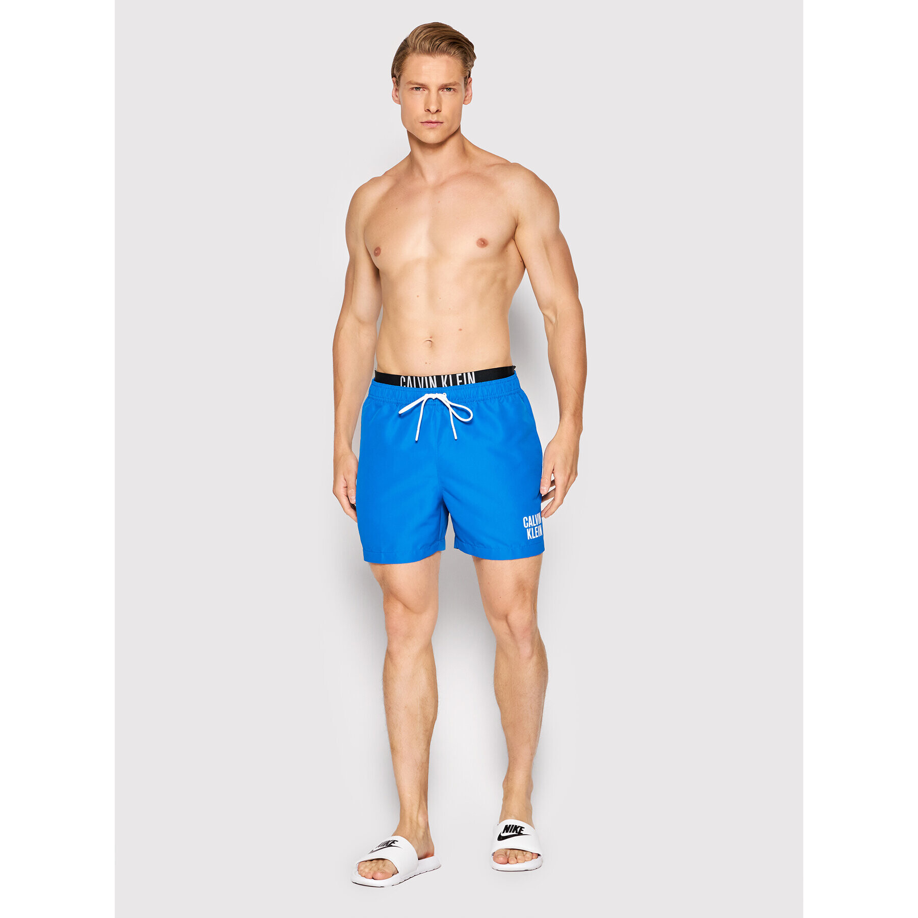 Calvin Klein Swimwear Plavecké šortky KM0KM00702 Modrá Regular Fit - Pepit.cz