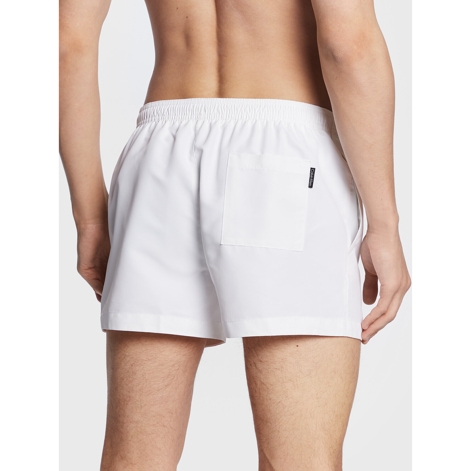 Calvin Klein Swimwear Plavecké šortky KM0KM00801 Bílá Regular Fit - Pepit.cz