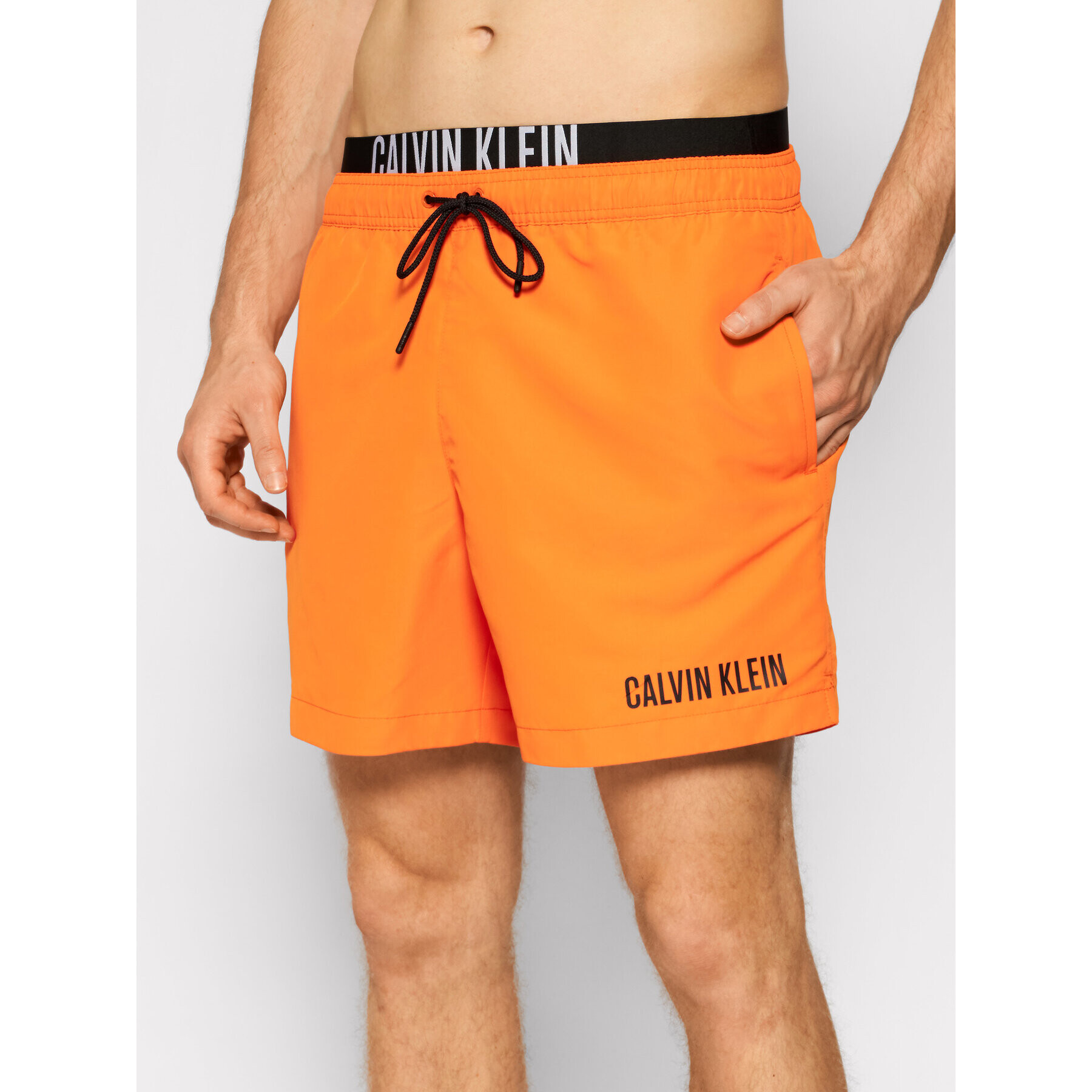 Calvin Klein Swimwear Plavecké šortky Medium Drawstring KM0KM00552 Oranžová Regular Fit - Pepit.cz