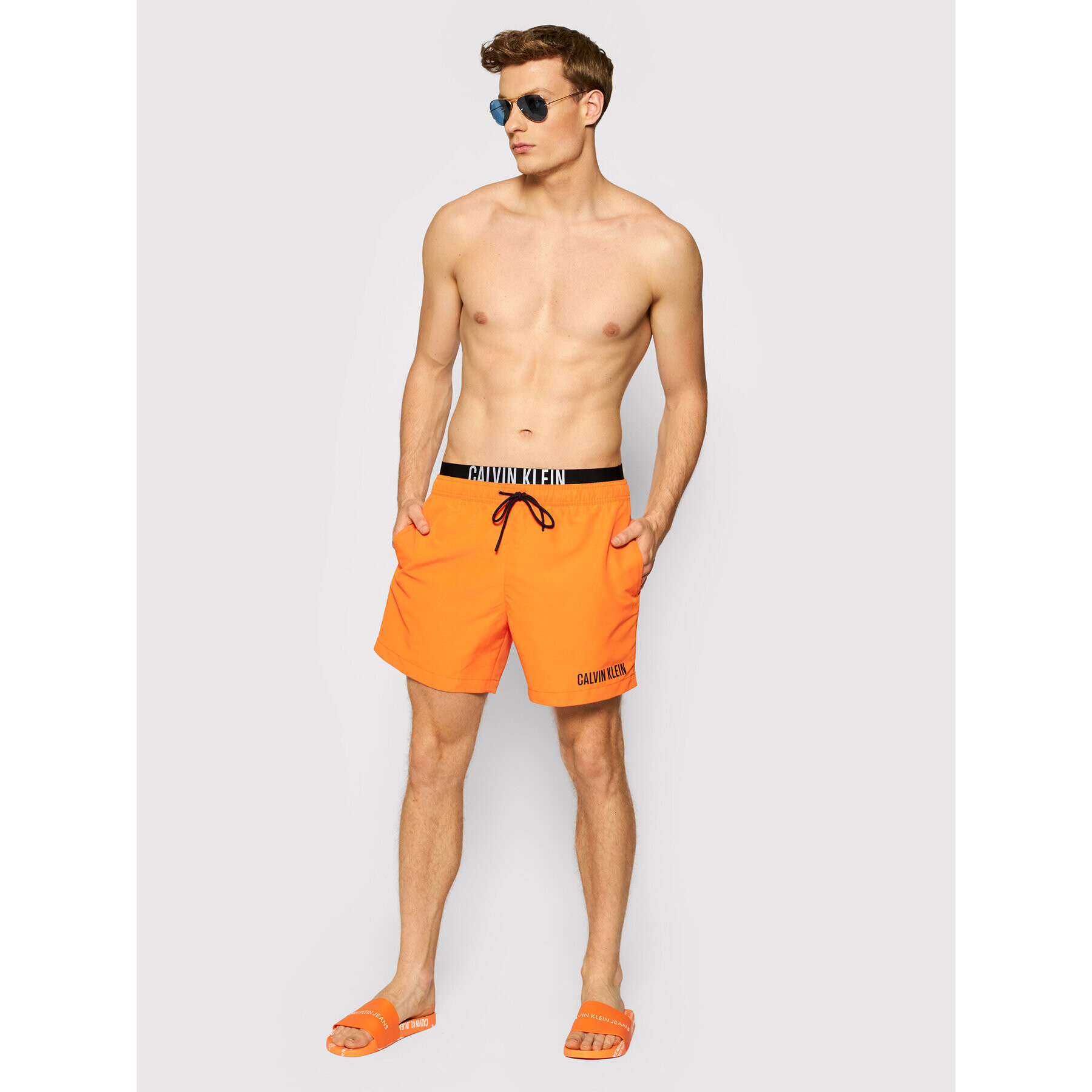 Calvin Klein Swimwear Plavecké šortky Medium Drawstring KM0KM00552 Oranžová Regular Fit - Pepit.cz