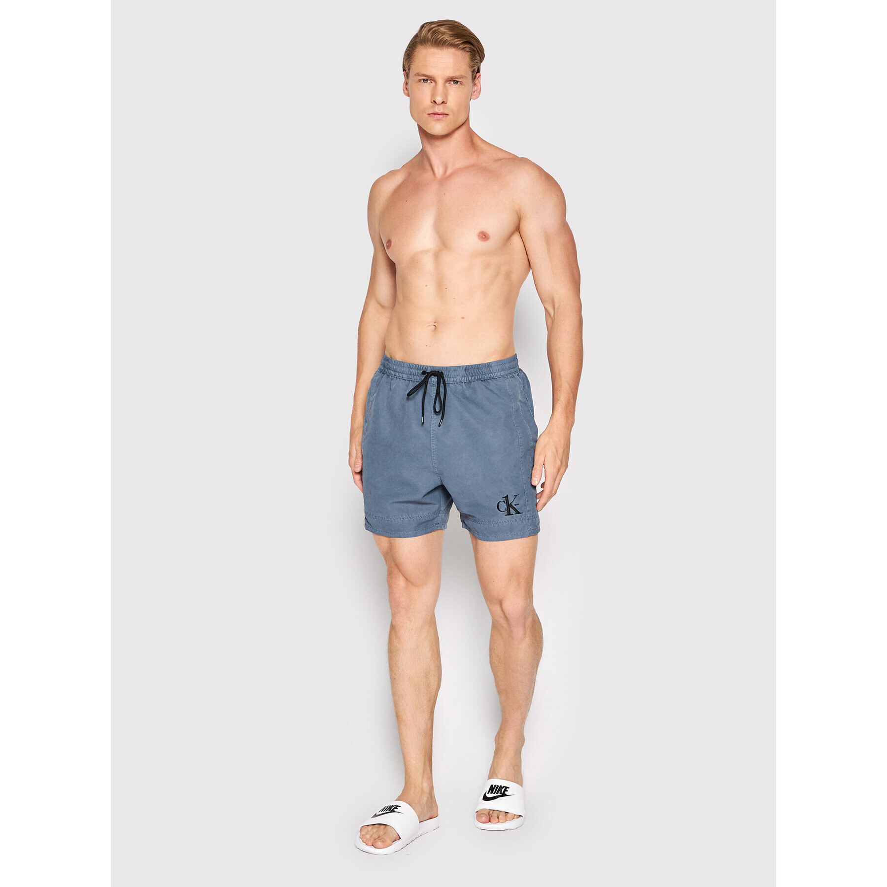 Calvin Klein Swimwear Plavecké šortky Medium KM0KM00742 Tmavomodrá Regular Fit - Pepit.cz