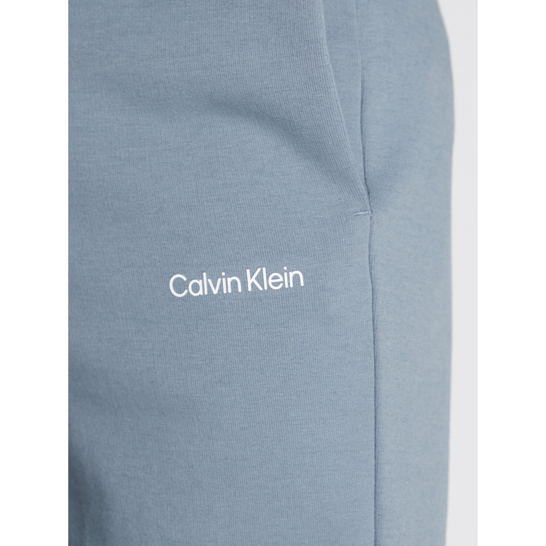 Calvin Klein Teplákové kalhoty Micro Logo K10K109940 Šedá Relaxed Fit - Pepit.cz