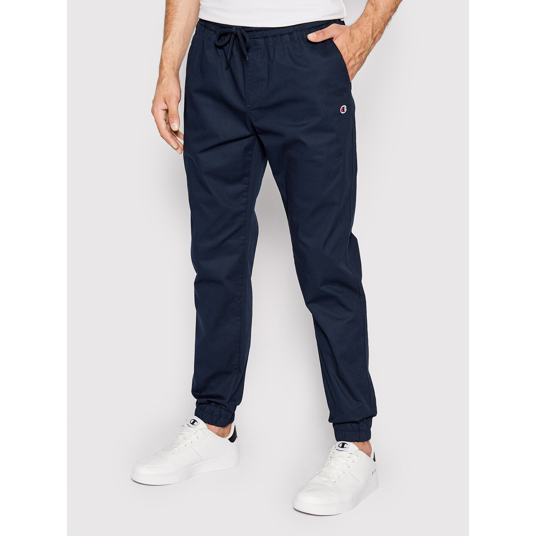 Champion Joggers kalhoty Twill Cuffed 214366 Tmavomodrá Slim Fit - Pepit.cz